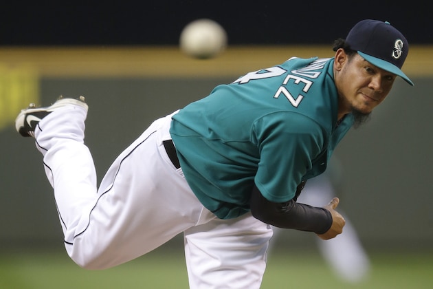 Seattle Mariners starting pitcher Felix Hernandez watches a pitch against theToronto Blue Jays in the fourth inning of a baseball game, Monday, Aug. 11, 2014, in Seattle. (AP Photo/Ted S. Warren)