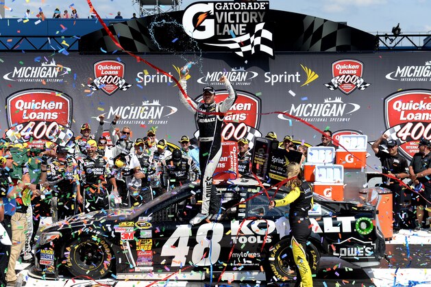 BROOKLYN, MI - JUNE 15:  Jimmie Johnson, driver of the #48 Lowe's/Kobalt Tools Chevrolet, celebrates in Victory Lane after winning the NASCAR Sprint Cup Series Quicken Loans 400 at Michigan International Speedway on June 15, 2014 in Brooklyn, Michigan.  (Photo by Jason Miller/Getty Images)