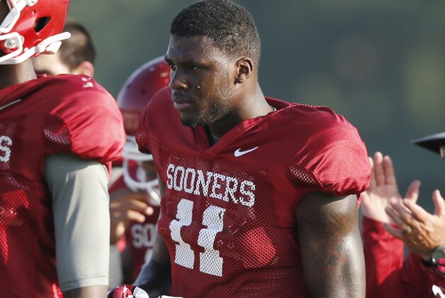 Oklahoma's Dorial Green-Beckham takes a water break during an NCAA college football team practice in Norman, Okla., Tuesday, Aug. 5. 2014. (AP Photo/Sue Ogrocki)