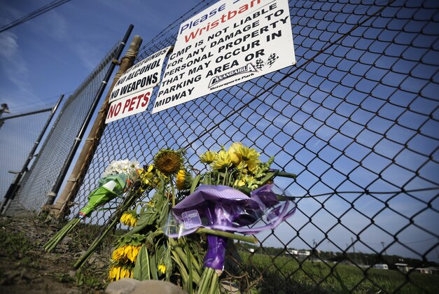 A small memorial of flowers is seen at Canandaigua Motorsports Park Monday, Aug. 11, 2014, in Canandaigua, N.Y. On Saturday night, Tony Stewart struck and killed Kevin Ward Jr., 20, a sprint car driver who had climbed from his car and was on the track trying to confront Stewart during a race at the track in upstate New York. Ontario County Sheriff Philip Povero said his department's investigation is not criminal and that Stewart was