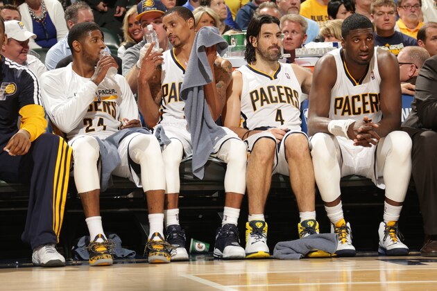 INDIANAPOLIS - APRIL 22:  Paul George #24, George Hill #3, Luis Scola #4 and Roy Hibbert #55 of the Indiana Pacers sit on the bench during Game two of the East Conference Quarter Finals against the Atlanta Hawks at Bankers Life Fieldhouse on April 222, 2014 in Indianapolis, Indiana.  NOTE TO USER: User expressly acknowledges and agrees that, by downloading and or using this Photograph, user is consenting to the terms and condition of the Getty Images License Agreement. Mandatory Copyright Notice: 2014 NBAE  (Photo by Ron Hoskins/NBAE via Getty Images)