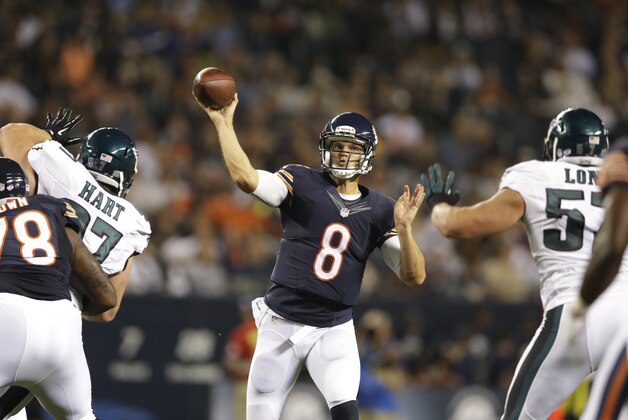 Chicago Bears quarterback Jimmy Clausen (8) throws a touchdown pass to wide receiver Micheal Spurlock (18) Chicago Bears quarterback Jimmy Clausen (8) throws a pass in the second half of an NFL preseason football game against the Philadelphia Eagles Friday, Aug. 8, 2014, in Chicago. (AP Photo/Nam Y. Huh)