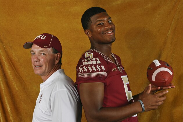 Florida State head coach Jimbo Fisher, left, and quarterback Jameis Winston (5) pose for a photo during their NCAA college football media day on Sunday, Aug. 10, 2014, in Tallahassee, Fla. Florida State starts its quest for back-to-back national championships Aug. 30 when they open against Oklahoma State in Arlington, Tex. (AP Photo/Phil Sears)
