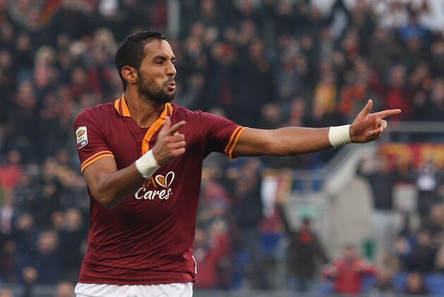 ROME, ITALY - DECEMBER 22:  Mehdi Benatia of AS Roma celebrates after scoring the third team's goal during the Serie A match between AS Roma and Calcio Catania at Stadio Olimpico on December 22, 2013 in Rome, Italy.  (Photo by Paolo Bruno/Getty Images)