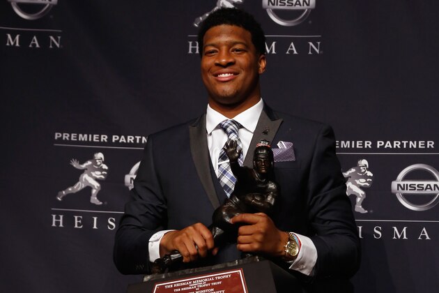 NEW YORK, NY - DECEMBER 14:  Jameis Winston, quarterback of the Florida State Seminoles, poses with the trophy during a press conference after the 2013 Heisman Trophy Presentation at the Marriott Marquis on December 14, 2013 in New York City.  (Photo by Jeff Zelevansky/Getty Images)