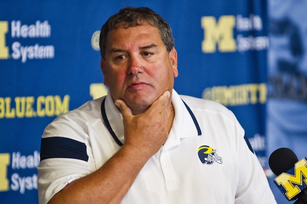 Michigan head coach Brady Hoke reacts to reporters' questions during a press conference at the NCAA college football team's preseason media day, Sunday, Aug. 10, 2014, in Ann Arbor, Mich. (AP Photo/Tony Ding)
