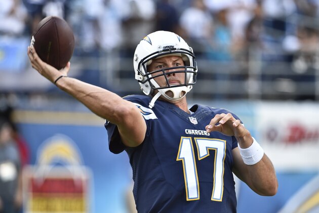 San Diego Chargers quarterback Philip Rivers gets loose throwing for a preseason NFL football game against the Dallas Cowboys Thursday, Aug. 7, 2014, in San Diego. (AP Photo/Denis Poroy)
