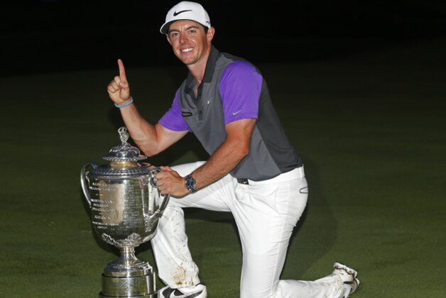 Rory McIlroy, of Northern Ireland, holds up the Wanamaker Trophy after winning the PGA Championship golf tournament at Valhalla Golf Club on Sunday, Aug. 10, 2014, in Louisville, Ky.  (AP Photo/Mike Groll)
