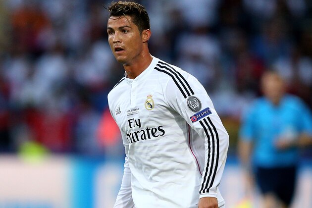 CARDIFF, WALES - AUGUST 12:  Cristiano Ronaldo of Real Madrid controls the ball during the UEFA Super Cup between Real Madrid and Sevilla FC at Cardiff City Stadium on August 12, 2014 in Cardiff, Wales.  (Photo by Clive Mason/Getty Images)