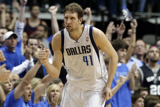 Dallas Mavericks' Dirk Nowitzki (41) of Germany celebrates sinking a three-point basket against the San Antonio Spurs in the second half of Game 4 of an NBA basketball first-round playoff series, Monday, April 28, 2014, in Dallas. The Spurs won 93-89. (AP Photo/Tony Gutierrez)