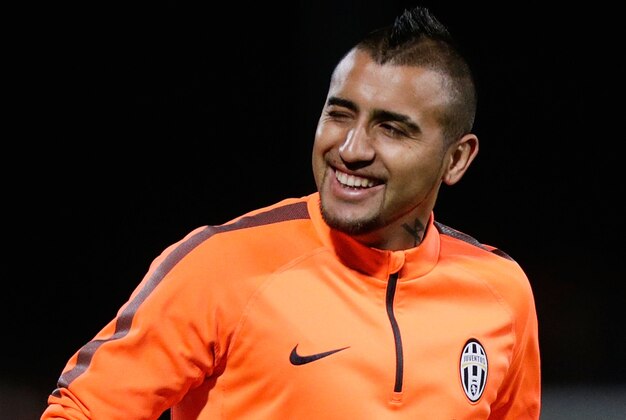 SYDNEY, AUSTRALIA - AUGUST 09:  Arturo Vidal smiles to fans during a Juventus training session at WIN Jubilee Stadium on August 9, 2014 in Sydney, Australia.  (Photo by Mark Metcalfe/Getty Images)