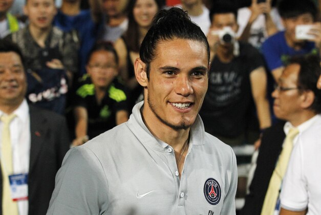 Paris Saint-Germain's Edinson Cavani gestures during a friendly match against Kitchee in Hong Kong Tuesday, July 29, 2014. (AP Photo/Kin Cheung)