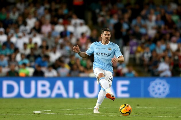 AL AIN, UNITED ARAB EMIRATES - MAY 15:  Javi Garcia of Manchester City in action during the friendly match between Al Ain and Manchester City at Hazza bin Zayed Stadium on May 15, 2014 in Al Ain, United Arab Emirates.  (Photo by Warren Little/Getty Images)