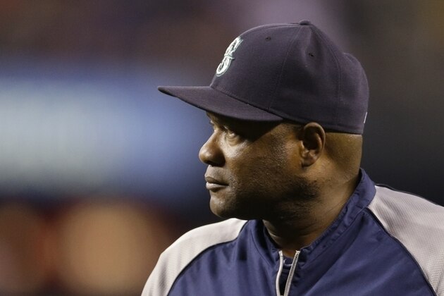 Seattle Mariners manager Lloyd McClendon, returns to the dugout after a pitching change in a baseball game against the Toronto Blue Jays, Tuesday, Aug. 12, 2014, in Seattle. (AP Photo/Ted S. Warren)