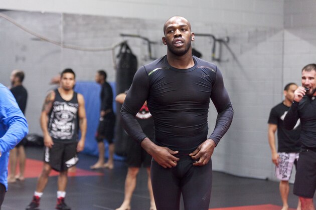 ALBUQUERQUE, NM - APRIL 2: UFC lightweight champion Jon 'Bones' Jones joins in for a warm up during an open training session for fans and media at the Jackson's Mixed Martial Arts and Fitness on April 2, 2014 in Albuquerque, New Mexico. (Photo by Aaron Sweet/Getty Images)