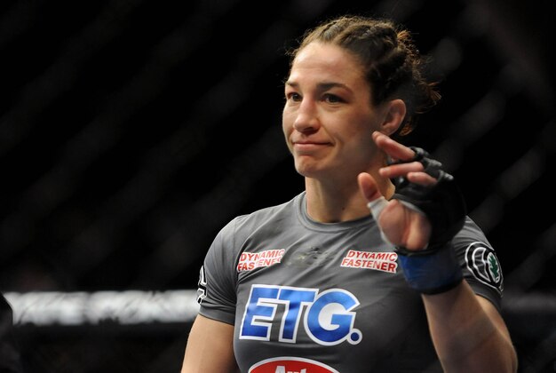 Feb 22, 2014; Las Vegas, NV, USA; Sara McMann waves to fans after being defeated in the first round of a women's bantamweight championship bout to Ronda Rousey during the main event of UFC 170 at Mandalay Bay.  Mandatory Credit: Stephen R. Sylvanie-USA TODAY Sports