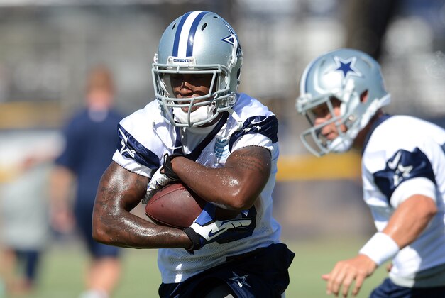 Jul 24, 2014; Oxnard, CA, USA; Dallas Cowboys running back Lance Dunbar (25) runs the ball during training camp at the River Ridge Playing Fields.  Mandatory Credit: Jayne Kamin-Oncea-USA TODAY Sports