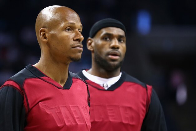 CHARLOTTE, NC - APRIL 28:  Ray Allen #34 of the Miami Heat and teammate LeBron James #6 wear a black head band and inside out warm up jersey before their game against the Charlotte Bobcats in Game Four of the Eastern Conference Quarterfinals during the 2014 NBA Playoffs at Time Warner Cable Arena on April 28, 2014 in Charlotte, North Carolina.  NOTE TO USER: User expressly acknowledges and agrees that, by downloading and or using this photograph, User is consenting to the terms and conditions of the Getty Images License Agreement.  (Photo by Streeter Lecka/Getty Images)