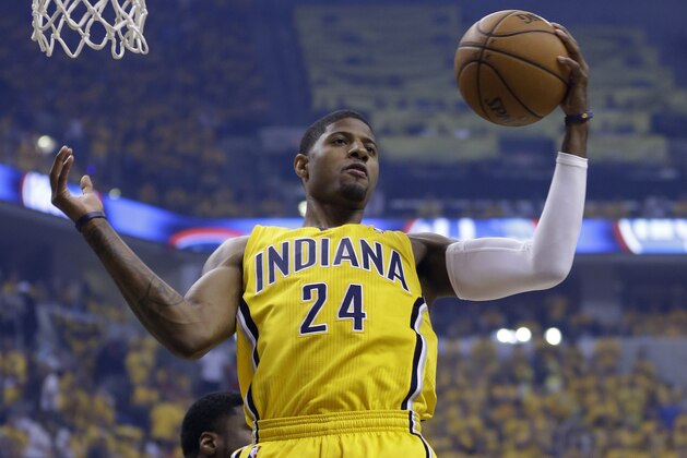 Indiana Pacers' Paul George grabs a rebound during the first half of Game 2 of the NBA basketball Eastern Conference finals against the Miami Heat in Indianapolis, Tuesday, May 20, 2014. (AP Photo/Michael Conroy) Indiana Pacers' Paul George grabs a rebound during the first half of Game 2 of the NBA basketball Eastern Conference finals against the Miami Heat in Indianapolis, Tuesday, May 20, 2014. (AP Photo/Michael Conroy)