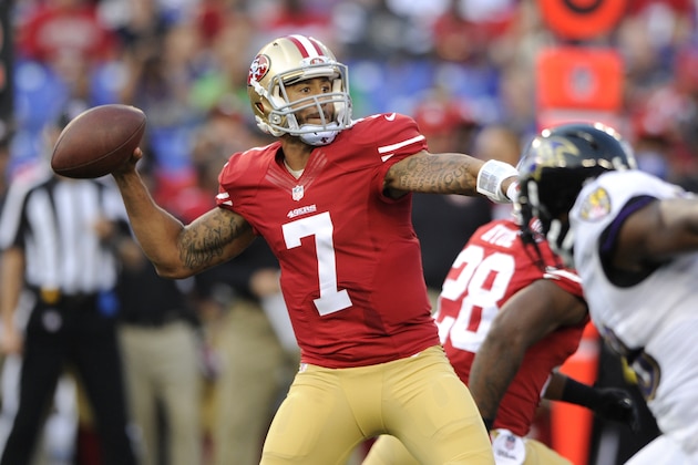 San Francisco 49ers quarterback Colin Kaepernick (7) throws to a receiver as he is pressured in the first half of an NFL preseason football game against the Baltimore Ravens, Thursday, Aug. 7, 2014, in Baltimore. (AP Photo/Nick Wass)