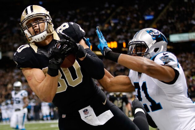 NEW ORLEANS, LA - DECEMBER 08:  Jimmy Graham #80 of the New Orleans Saints has a pass broken up by  Mike Mitchell #21 of the Carolina Panthers at Mercedes-Benz Superdome on December 8, 2013 in New Orleans, Louisiana.  (Photo by Chris Graythen/Getty Images)