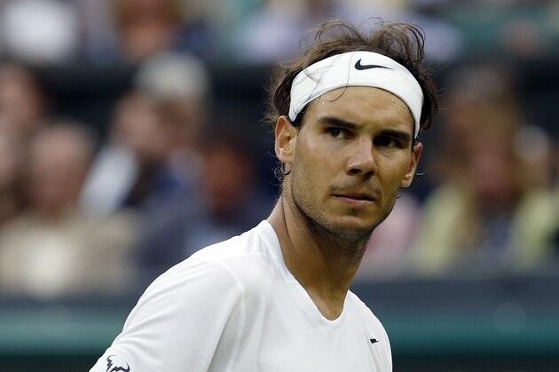 Rafael Nadal of Spain celebrates a point against Mikhail Kukushkin of Kazakhstan during their match at the All England Lawn Tennis Championships in Wimbledon, London, Saturday, June 28, 2014. (AP Photo/Ben Curtis)