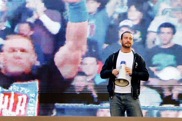 WWE superstar CM Punk addresses the crowd from the Madison Square Garden marquee, Friday, Nov. 18, 2011, in New York, during a rally leading up to the 25th Anniversary of Survivor Series, taking place Sunday at Madison Square Garden.  The event will feature actor and wrestling favorite Dwayne