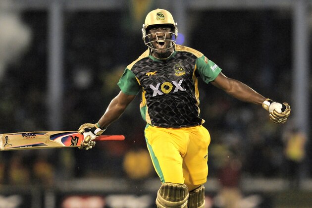 PORT OF SPAIN, TRINIDAD AND TOBAGO - AUGUST 24:  Andre Russell of Jamaica Tallawahs celebrates victory against Guyana Amazon Warriors during the Final of the Caribbean Premier League between Guyana Amazon Warriors v Jamaica Tallawahs at Queens Park Oval on August 24, 2013 in Port of Spain, Trinidad and Tobago. (Photo by Randy Brooks/Getty Images Latin America for CPL)
