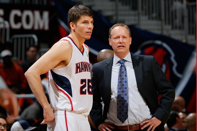 ATLANTA, GA - DECEMBER 06:  Kyle Korver #26 and Mike Budenholzer of the Atlanta Hawks converse during the game against the Cleveland Cavaliers at Philips Arena on December 6, 2013 in Atlanta, Georgia.  NOTE TO USER: User expressly acknowledges and agrees that, by downloading and or using this photograph, User is consenting to the terms and conditions of the Getty Images License Agreement.  (Photo by Kevin C. Cox/Getty Images)