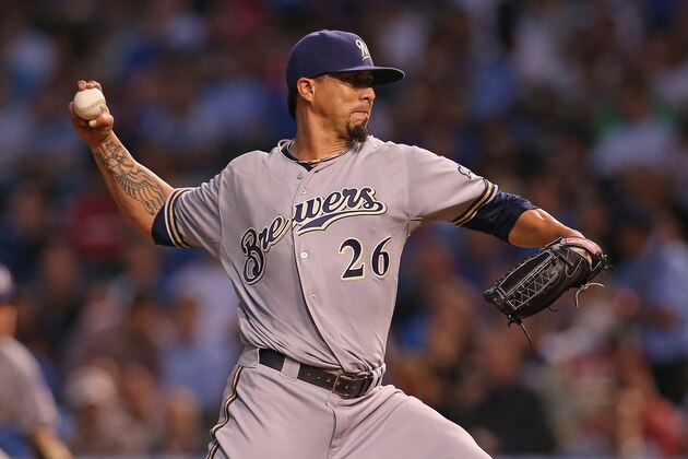 CHICAGO, IL - AUGUST 13:  Starting pitcher Kyle Lohse #26 of the Milwaukee Brewers delivers the ball against the Chicago Cubs at Wrigley Field on August 13, 2014 in Chicago, Illinois.  (Photo by Jonathan Daniel/Getty Images)