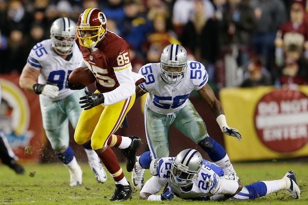 LANDOVER, MD - DECEMBER 30:   Leonard Hankerson #85 of the Washington Redskins carries the ball against the defense of  Morris Claiborne #24 and  Ernie Sims #59 of the Dallas Cowboys at FedExField on December 30, 2012 in Landover, Maryland.  (Photo by Rob Carr/Getty Images)