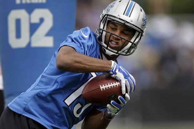 Detroit Lions wide receiver Golden Tate catches a pass during NFL football training camp in Allen Park, Mich., Monday, July 28, 2014. (AP Photo/Paul Sancya)