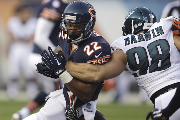 Chicago Bears running back Matt Forte (22) is tackled by Philadelphia Eagles safety Malcolm Jenkins (27) and linebacker Connor Barwin (98) during the first half of an NFL preseason football game Friday, Aug. 8, 2014, in Chicago. (AP Photo/Nam Y. Huh)