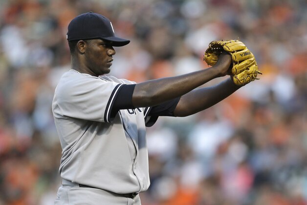 New York Yankees starting pitcher Michael Pineda prepares to throw to the Baltimore Orioles in the first inning of a baseball game, Wednesday, Aug. 13, 2014, in Baltimore. (AP Photo/Patrick Semansky)