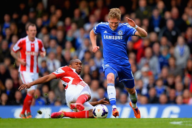 LONDON, ENGLAND - APRIL 05:  Wilson Palacios of Stoke City tackles Andre Schurrle of Chelsea during the Barclays Premier League match between Chelsea and Stoke City at Stamford Bridge on April 5, 2014 in London, England.  (Photo by Mike Hewitt/Getty Images)