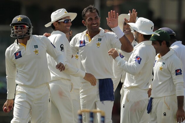 Pakistani bowler Wahab Riaz, center, celebrates with teammates the dismissal of Sri Lankan batsman Upul Tharanga during the first day of the second test cricket match between Sri Lanka and Pakistan in Colombo, Sri Lanka, Thursday, Aug. 14, 2014. (AP Photo/Eranga Jayawardena)