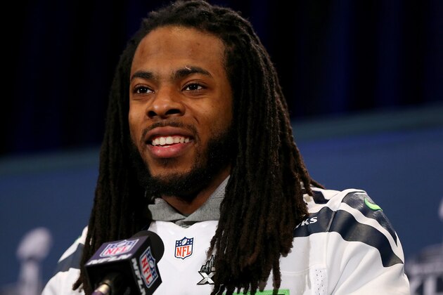 JERSEY CITY, NJ - JANUARY 30:  Richard Sherman #25 of the Seattle Seahawks addresses the media during Super Bowl XLVIII media availability at the Westin Hotel January 30, 2014 in Jersey City, New Jersey. The Denver Broncos and Seattle Seahawks will meet in Super Bowl XLVIII at Metlife Stadium on February 2, 2014.  (Photo by Elsa/Getty Images)