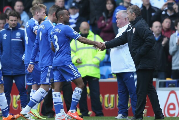 CARDIFF, WALES - MAY 11:  Ole Gunnard Solskjaer, (R) the manager of Cardiff City shakes the hand of Ashley Cole as he leaves the field after their victory during the Barclays Premier League match between Cardiff City and Chelsea at the Cardiff City Stadium on May 11, 2014 in Cardiff, Wales.  (Photo by David Rogers/Getty Images)