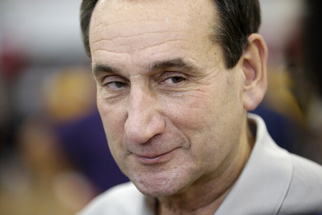 Head coach Mike Krzyzewski smiles while speaking with the media during a USA Basketball minicamp practice Monday, July 28, 2014, in Las Vegas. (AP Photo/John Locher)