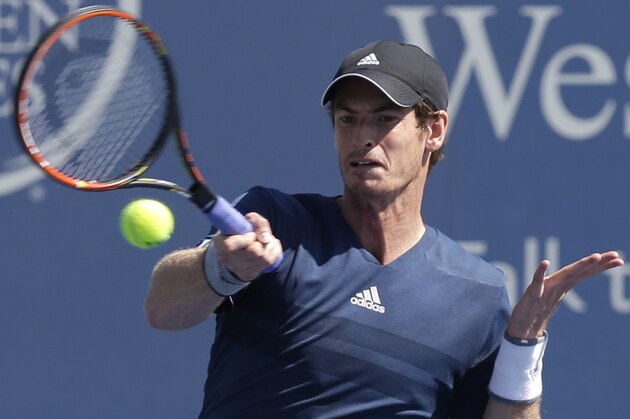Andy Murray, from Great Britain, hits a forehand against Joao Sousa, from Portugal, during a match at the Western & Southern Open tennis tournament, Wednesday, Aug. 13, 2014, in Mason, Ohio. Murray won 6-3, 6-3. (AP Photo/Al Behrman)