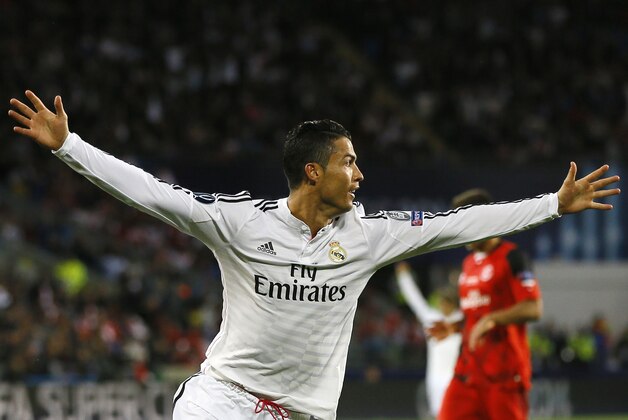 Real Madrid’s Cristiano Ronaldo celebrates after scoring the second goal during the UEFA Super Cup soccer match between Read Madrid and Sevilla at Cardiff City Stadium in Wales Tuesday, Aug. 12, 2014. (AP Photo/Kirsty Wigglesworth)