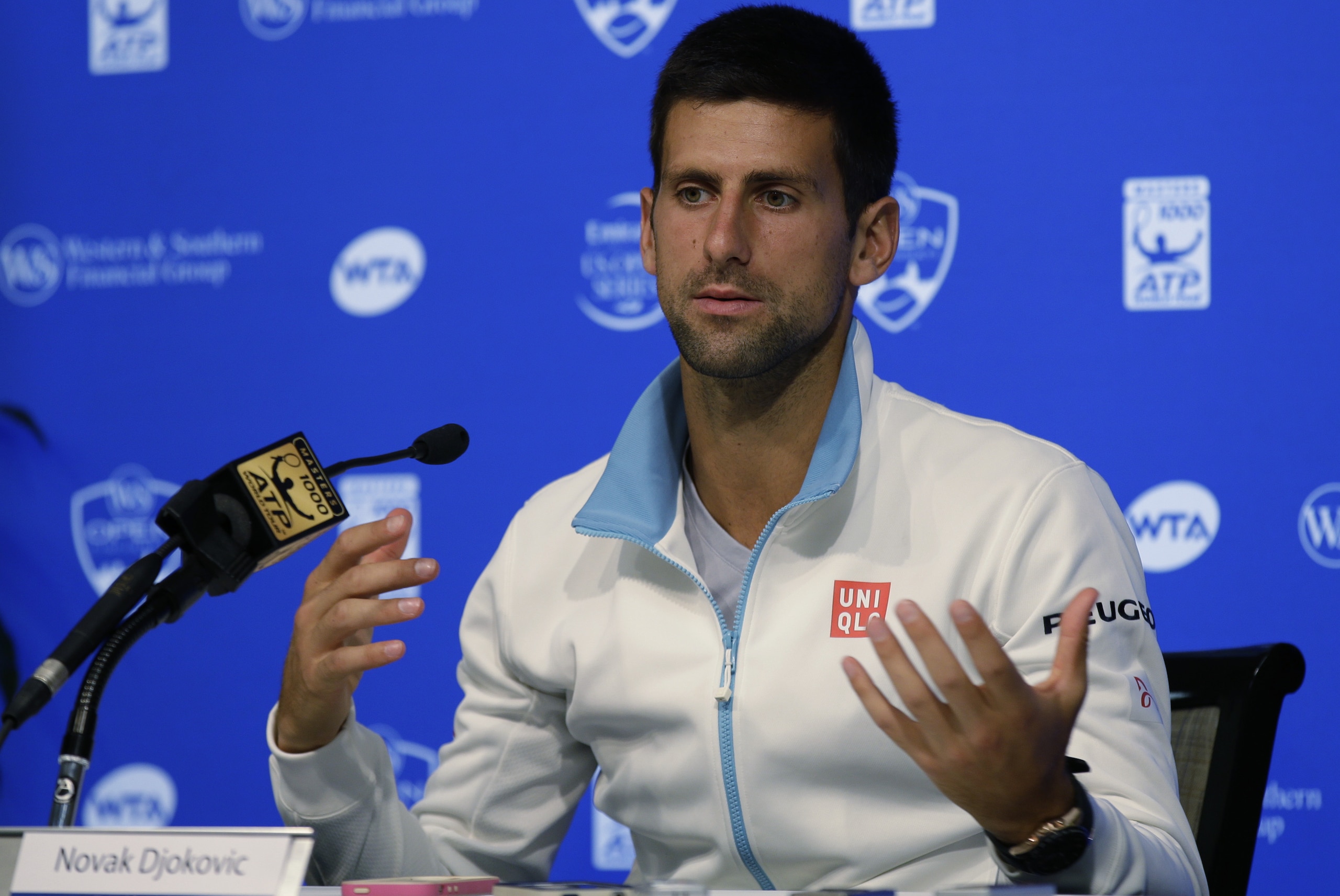 Novak Djokovic, from Serbia, answers questions during a news conference at the Western & Southern Open tennis tournament, Sunday, Aug. 10, 2014, in Mason, Ohio. Djokovic, the top seed, has been a finalist four times at the event, but has never won. (AP Photo/Al Behrman)