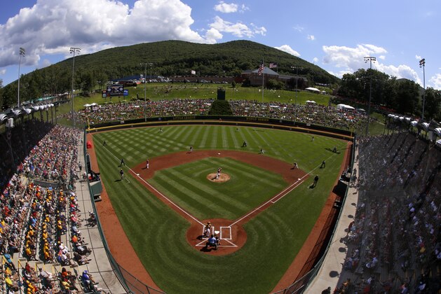 In this photo made with a fisheye lens Lynnwood, Washington pitcher Ian Michael delivers the first pitch of a baseball game to Chicago's Pierce Jones during United States pool play in Lamade Stadium at the Little League World Series tournament in South Williamsport, Pa., Thursday, Aug. 14, 2014. Pierce opened the game with a solo home run and Chicago won 12-2. (AP Photo/Gene J. Puskar)