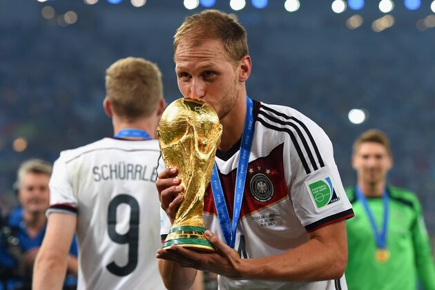 RIO DE JANEIRO, BRAZIL - JULY 13:  Benedikt Hoewedes of Germany kisses the World Cup trophy  after defeating Argentina 1-0 in extra time during the 2014 FIFA World Cup Brazil Final match between Germany and Argentina at Maracana on July 13, 2014 in Rio de Janeiro, Brazil.  (Photo by Matthias Hangst/Getty Images)