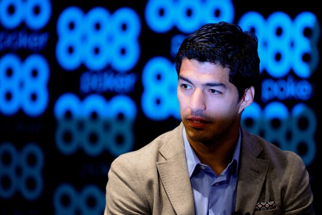 BARCELONA, SPAIN - MAY 14:  Luis Suarez of Liverpool faces the media during the presentation as new Ambassador for 888poker on May 14, 2014 in Barcelona, Spain.  (Photo by David Ramos/Getty Images)