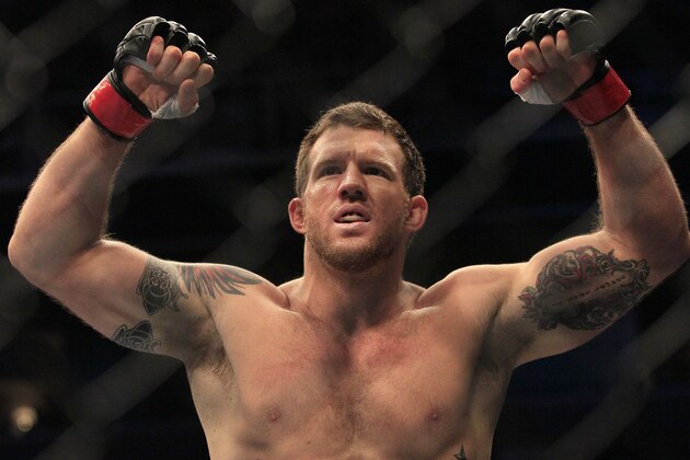 Ryan Bader celebrates after beating Jason Brilz by knockout in the first round of a UFC 139 Mixed Martial Arts light heavyweight bout in San Jose, Calif., Saturday, Nov. 19, 2011. (AP Photo/Jeff Chiu)