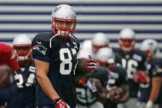 New England Patriots tight end Rob Gronkowski (87) carries a football during an NFL football training camp joint practice of the New England Patriots and the Philadelphia Eagles in Foxborough, Mass., Wednesday, Aug. 13, 2014. (AP Photo/Elise Amendola)