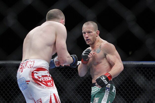 May 25, 2013; Las Vegas, NV, USA; Gray Maynard squares off against TJ Grant during UFC 160 at the MGM Grand Garden Arena. Mandatory Credit: Gary A. Vasquez-USA TODAY Sports May 25, 2013; Las Vegas, NV, USA; Gray Maynard squares off against TJ Grant during UFC 160 at the MGM Grand Garden Arena. Mandatory Credit: Gary A. Vasquez-USA TODAY Sports