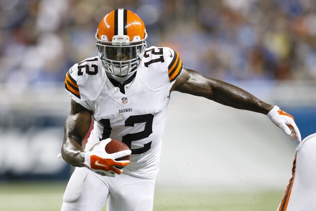 Cleveland Browns wide receiver Josh Gordon (12) runs the ball against the Detroit Lions during a preseason NFL football game at Ford Field in Detroit, Saturday, Aug. 9, 2014. (AP Photo/Rick Osentoski)