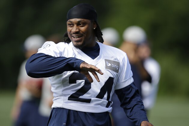 Seattle Seahawks running back Marshawn Lynch talks with a teammate during a session of NFL football training camp, Tuesday, Aug. 5, 2014, in Renton, Wash. (AP Photo/Ted S. Warren) Seattle Seahawks running back Marshawn Lynch talks with a teammate during a session of NFL football training camp, Tuesday, Aug. 5, 2014, in Renton, Wash. (AP Photo/Ted S. Warren)